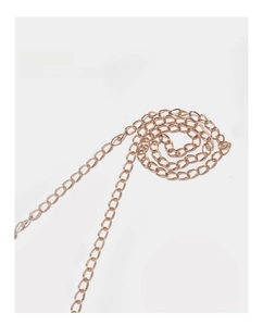 Close-up of shiny gold chain strap with polished oval links for shoulder bags
