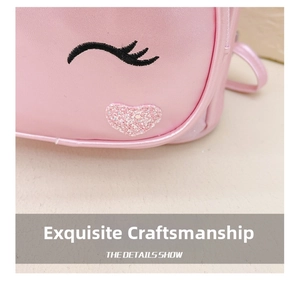 Detailed embroidery of eyelashes and pink glitter heart on a preschool girl's backpack