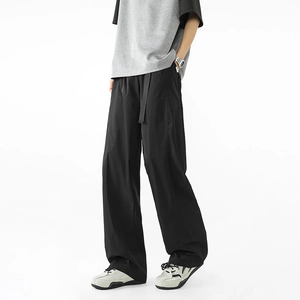 Pantalones casuales negros de pierna ancha para hombre con cinturón a juego y caída