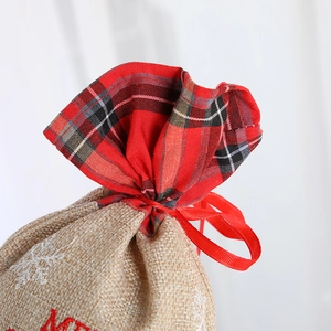 Linen Christmas gift bag with festive red tartan trim and Merry Christmas embroidery