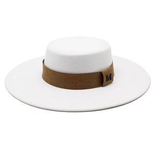 Classic white flat top boater hat with a brown decorative band and metal M emblem
