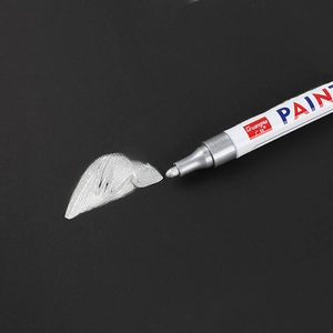 GuangNa silver oil-based paint marker for graffiti and tire marking on black surface
