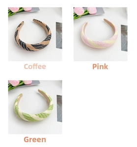 Detail showing woven textures of three candy-colored hairbands in brown, pink, and green