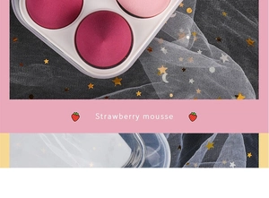 Detail of strawberry mousse makeup palette with pink and rose powder on starry tulle
