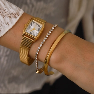 Vintage gold square watch and zircon bracelet set for women on model's wrist