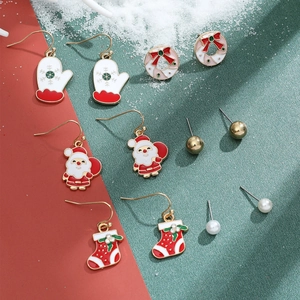 Detailed set of Christmas earrings featuring Santa, wreaths, and festive enamel charms