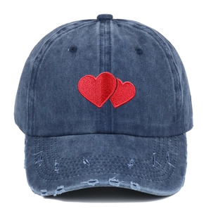 Vintage navy blue washed denim baseball cap with red heart embroidery and distressed brim