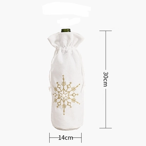 White wine bottle cover with gold snowflake embroidery and pearl accents measuring 30x14cm