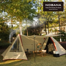 Detail of a white full cotton camping tent with double slope roof and chimney vent hole