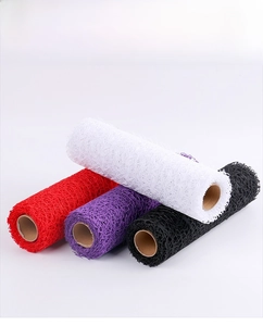 Macro detail of jacquard mesh rolls in multiple colors for floral bouquet decoration