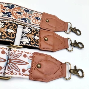 Three ethnic style 5cm wide replacement bag straps in blue, orange and gold patterns