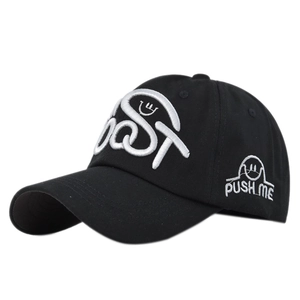 Close-up of side embroidery with Push Me text and smiley face on black baseball cap