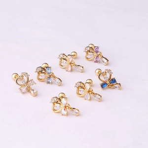 Ensemble de boucles d'oreilles nœud et cœur en acier doré avec zircons colorés