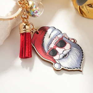Cool Santa Claus keychain with sunglasses, red tassel, and star-filled ball charm