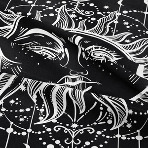 Detailed close-up of woven polyester fabric with sun and moon bohemian pattern