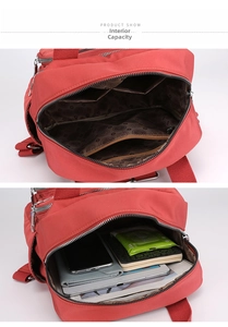 Detail view showing internal compartments and storage capacity of a red nylon backpack