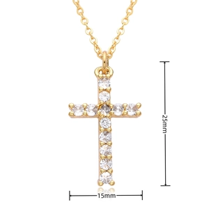 Detailed view of gold cross pendant with cubic zirconia, sized 15mm by 25mm