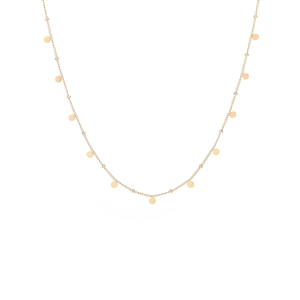 Detailed macro view of minimalist gold plated titanium steel necklace with small round charms