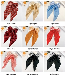Detail showcasing nine different plaid and silk ribbon bow hair clips in various colors