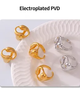 Detail of PVD electroplated hollow waterdrop rings in 18k gold and silver finish