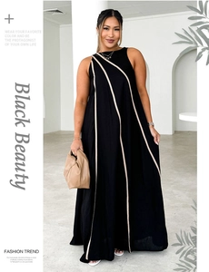 Detail of a black sleeveless maxi dress with beige stripes and round neck design