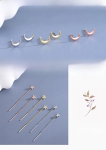Detail view of S925 silver moon and flower earrings in silver gold and rose gold finishes