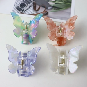 Colorful acetate butterfly hair clips in marble and iridescent patterns for women