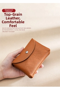 Close-up of genuine leather coin purse with lychee grain texture and metal snap button