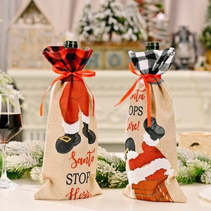 Christmas wine bottle cover with Santa STOP Here text and festive plaid pattern decor