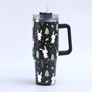 Detail of 40oz stainless steel mug with Christmas rabbit and tree pattern printing