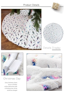 Detail of white plush Christmas tree skirt with iridescent gold feather prints and velcro