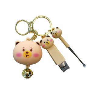 Adorable cartoon bear nail clipper and ear pick keychain set with golden bell pendant