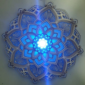 Detailed top view of a multi-layer laser-cut wooden Mandala yoga night light with LED