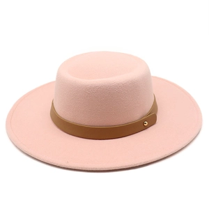 Detail of pink wool felt flat top hat with brown leather band and gold metal rivet