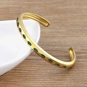 Minimalist 18k gold plated C-shaped open bracelet with oval green marquise cubic zirconia