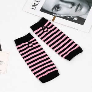 Detail of pink and black striped knit arm warmers with reinforced thumb hole design