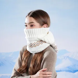 Winter knitted hood with neck warmer and geometric patterns on snow mountain background