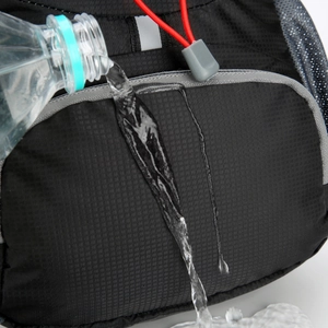 Close-up of waterproof nylon fabric with water droplets on men outdoor waist bag