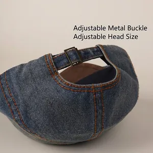 Adjustable navy denim ivy cap with orange stitching and metal herringbone buckle
