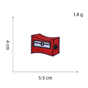 Detailed size chart of red pencil sharpener embroidered patch measuring 5.5cm by 4cm