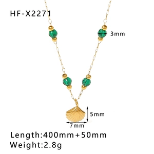 Detail view of gold shell pendant necklace with green turquoise beads and size dimensions