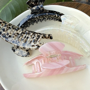 Elegant large acetate claw clips set in four colors on a ceramic tray home decor