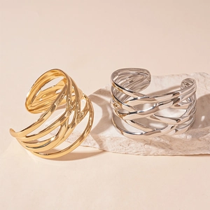 Minimalist multi-layer intertwined geometric open bangle in polished gold and silver finishes