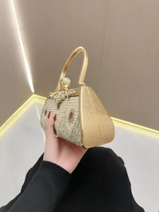 Elegant gold evening clutch bag with white pearls and rhinestones in geometric patterns