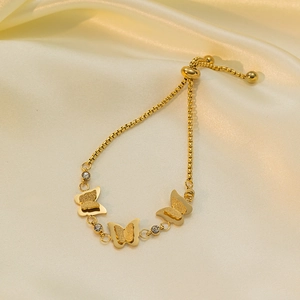 Gold butterfly bracelet with adjustable slider clasp and sparkling crystal accents