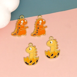 Cartoon enamel dinosaur charms in orange and yellow for DIY necklaces and bracelets