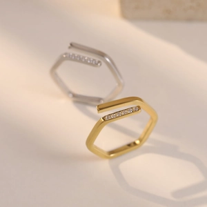 Minimalist irregular hexagonal open rings in gold and silver finish with pavé set zircon stones
