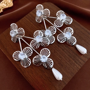 Silver hollow flower drop earrings with clear cubic zirconia and white teardrop pearls