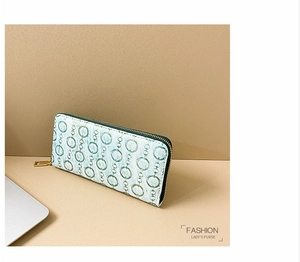 Detail of floral chain pattern on cream PU leather purse with gold hardware zipper