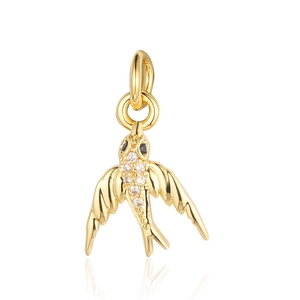 Exquisite golden bird pendant inlaid with sparkling zircons on a white background